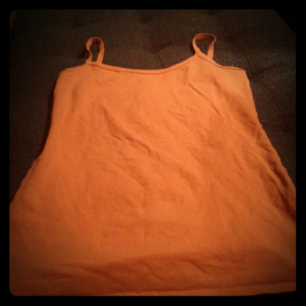 A salmon  colored tank top